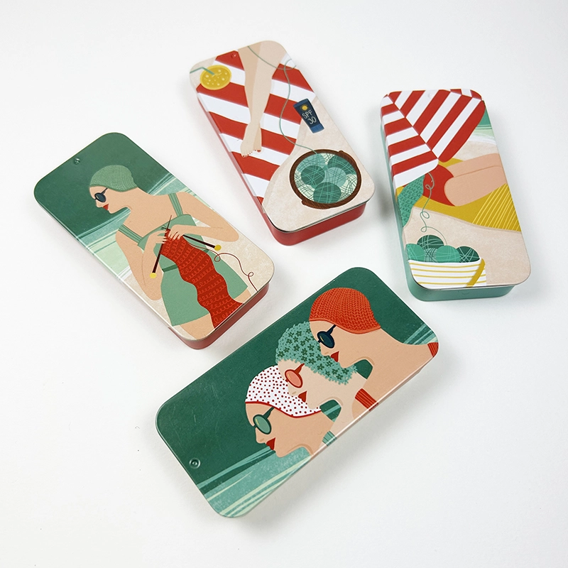 four tinboxes with retro inspired illustrations